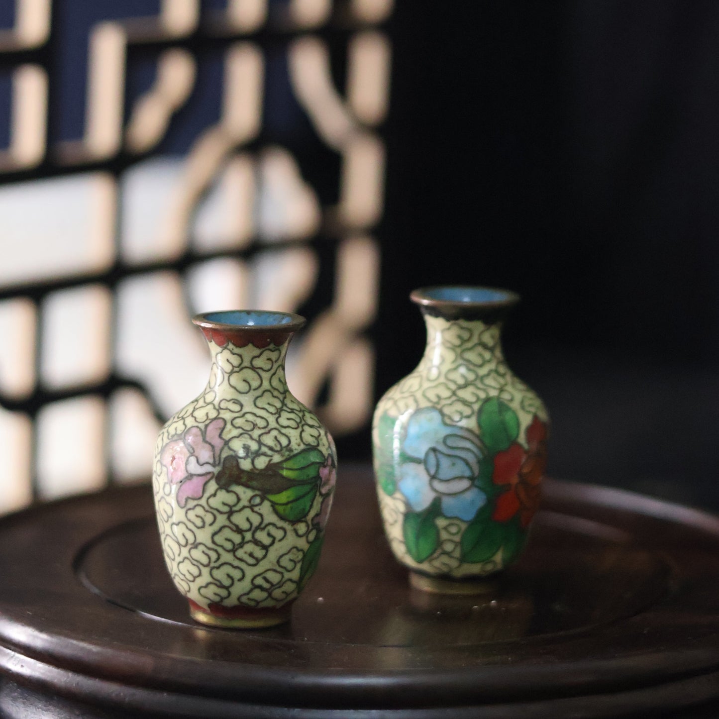 A petite pair of mid-century vases crafted in a cloisonné-style technique
