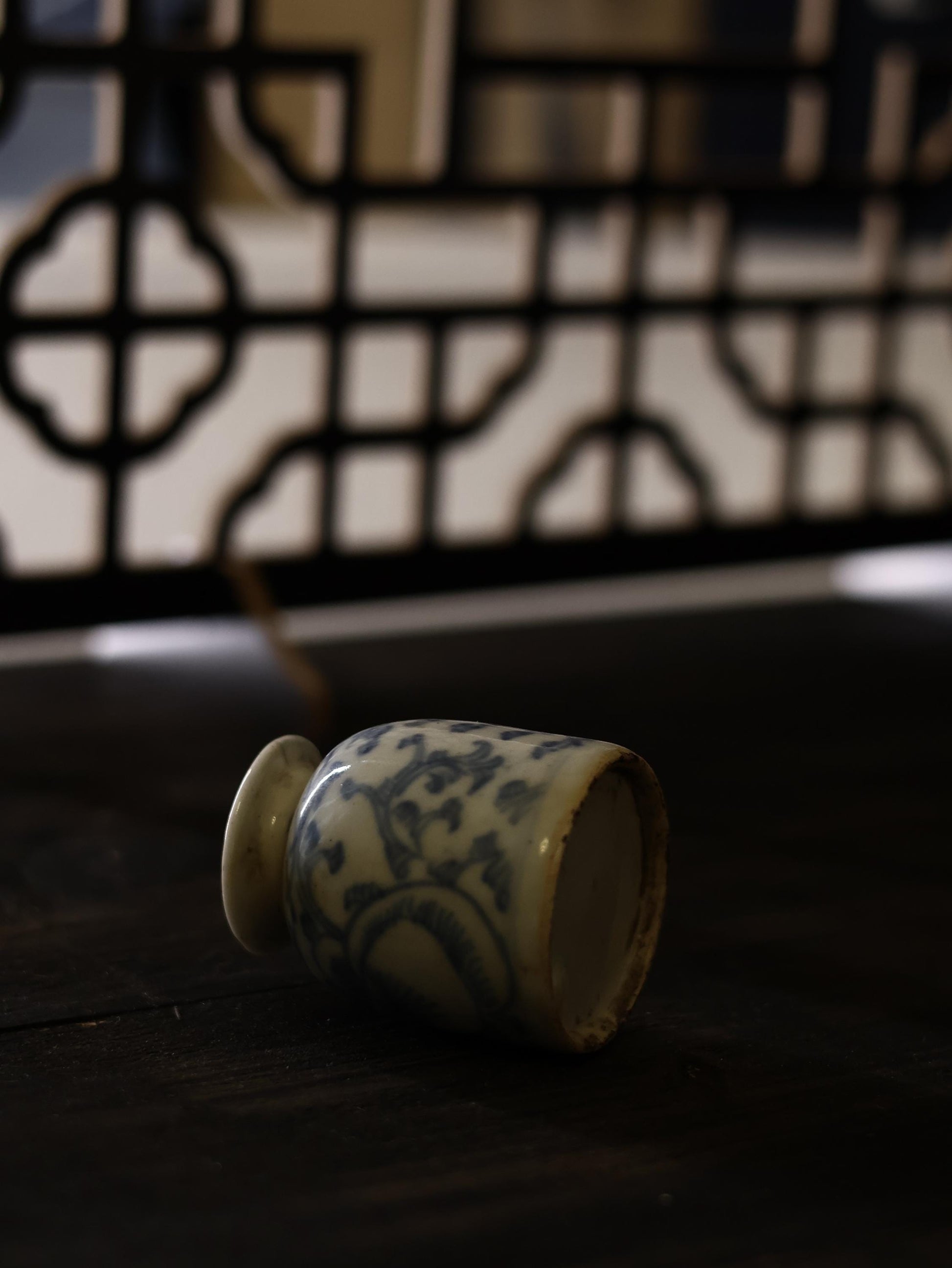 This 18th-century Qing Dynasty blue and white porcelain vase showcases intricate hand-painted designs typical of traditional Chinese craftsmanship. The delicate floral patterns reflect the artistic precision of the Qing era, making it a valuable piece for antique collectors and porcelain enthusiasts.