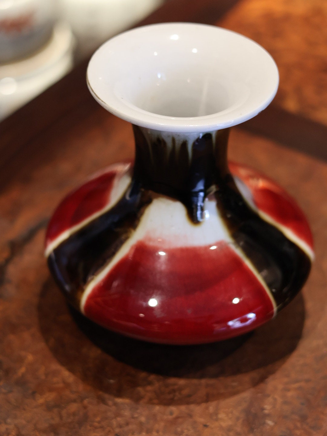 The flared mouth of this rare vintage vase reveals the glossy interior and smooth, flawless glaze. This top-down shot captures the dynamic interplay of colors that make this Jingdezhen piece truly unique.