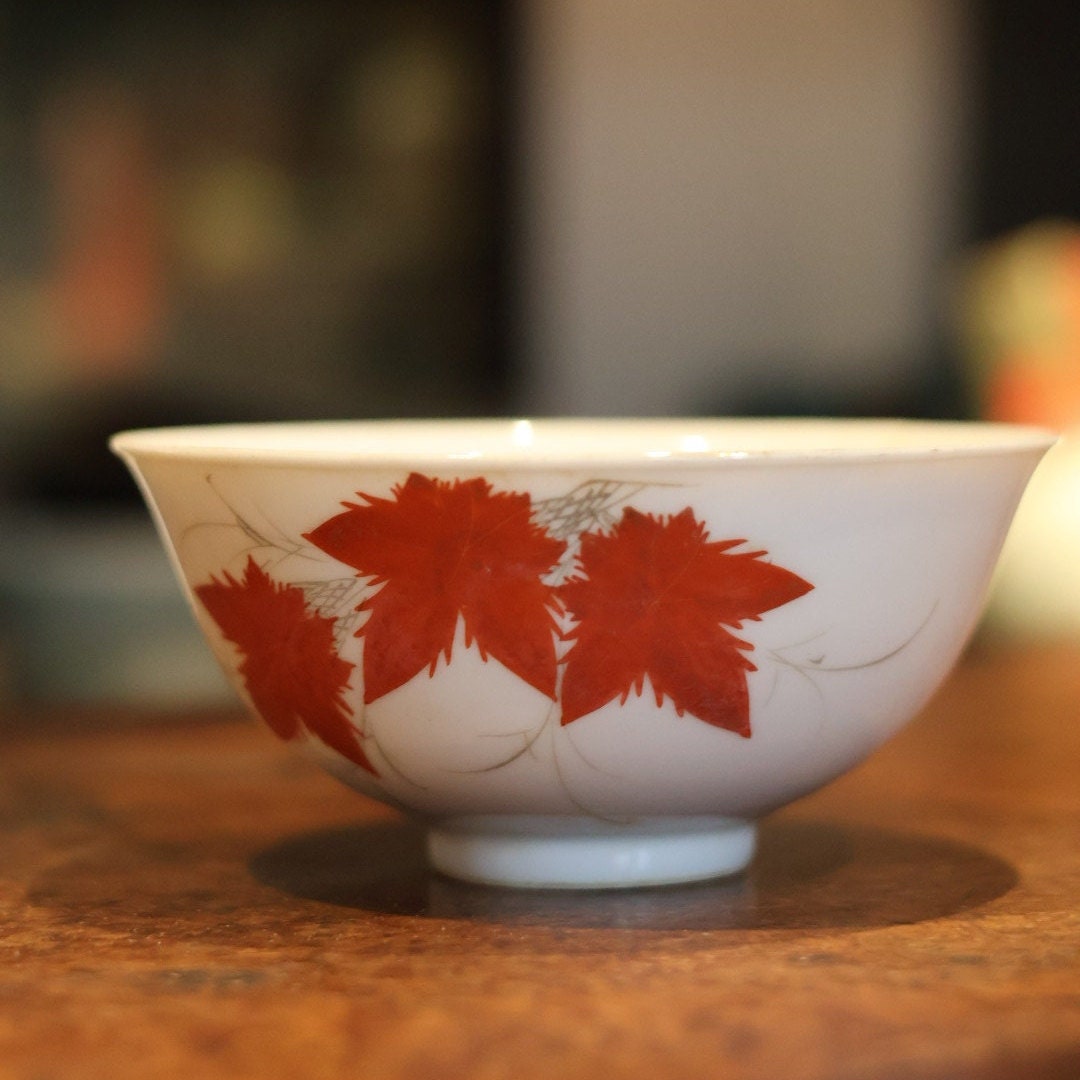 Close-up of the unique maple leaf design on the vintage bowl, highlighting the refined craftsmanship and crackle glaze.